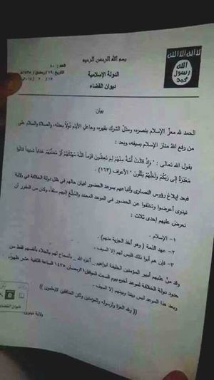 Una delle lettere di minaccia distribuite dalle milizie radicali islamiche dell'Isil. Foto Asianews. 