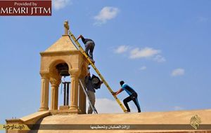Chiese e simboli cristiani distrutti dall'Isis in Iraq. Foto Ansa. 