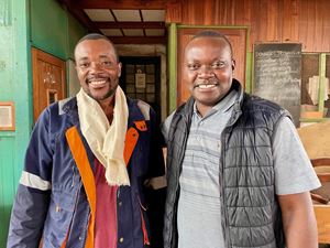 Don Patrick Mwenya, right, with a teacher from the carpentry course.