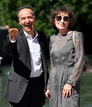 With his wife Nicoletta Braschi